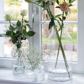 Glass vase decorated with meadow flowers